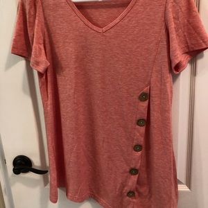 Tunic with asymmetric hem and button detail